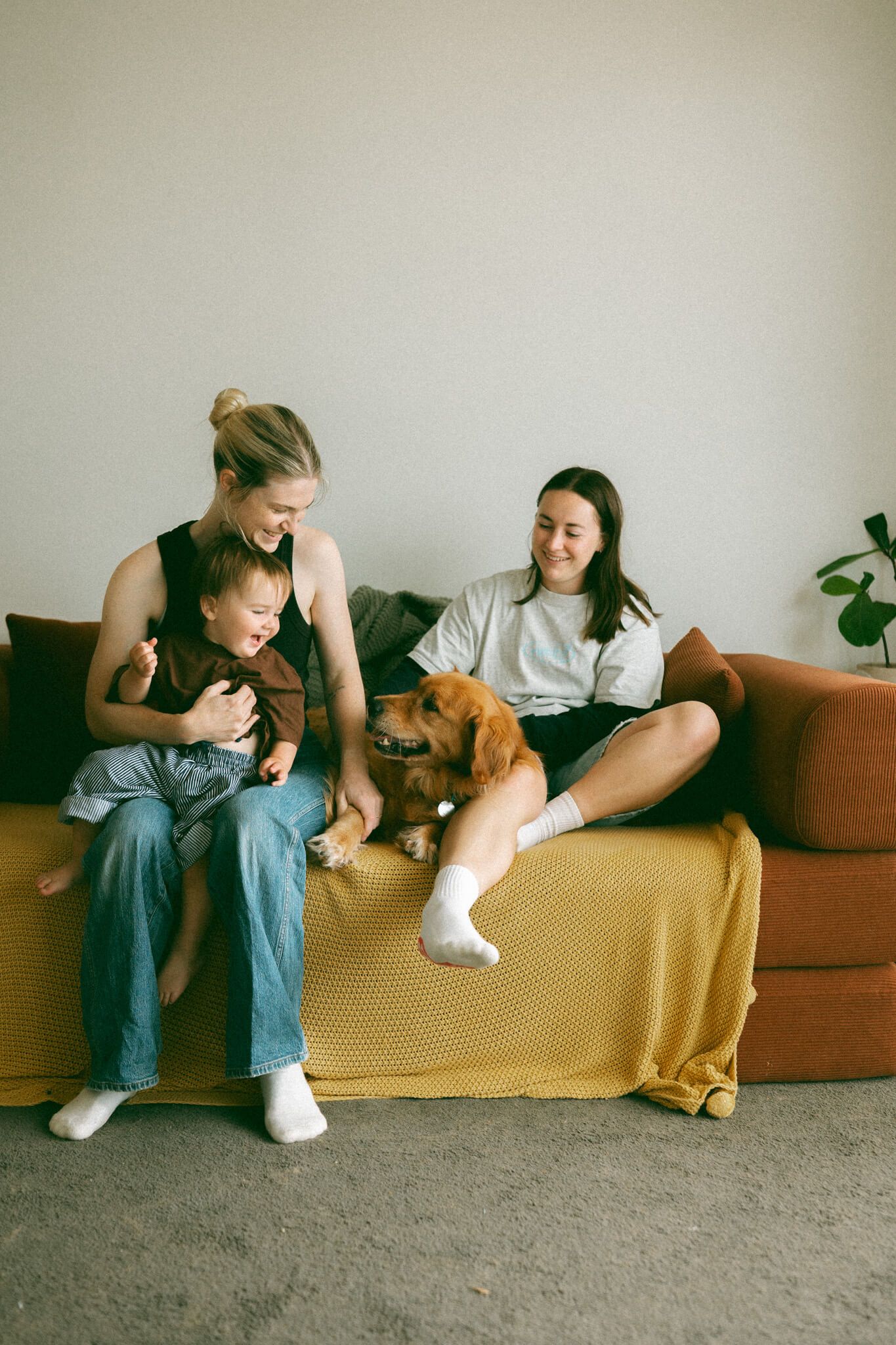 Melbourne family cuddling outside in their garden