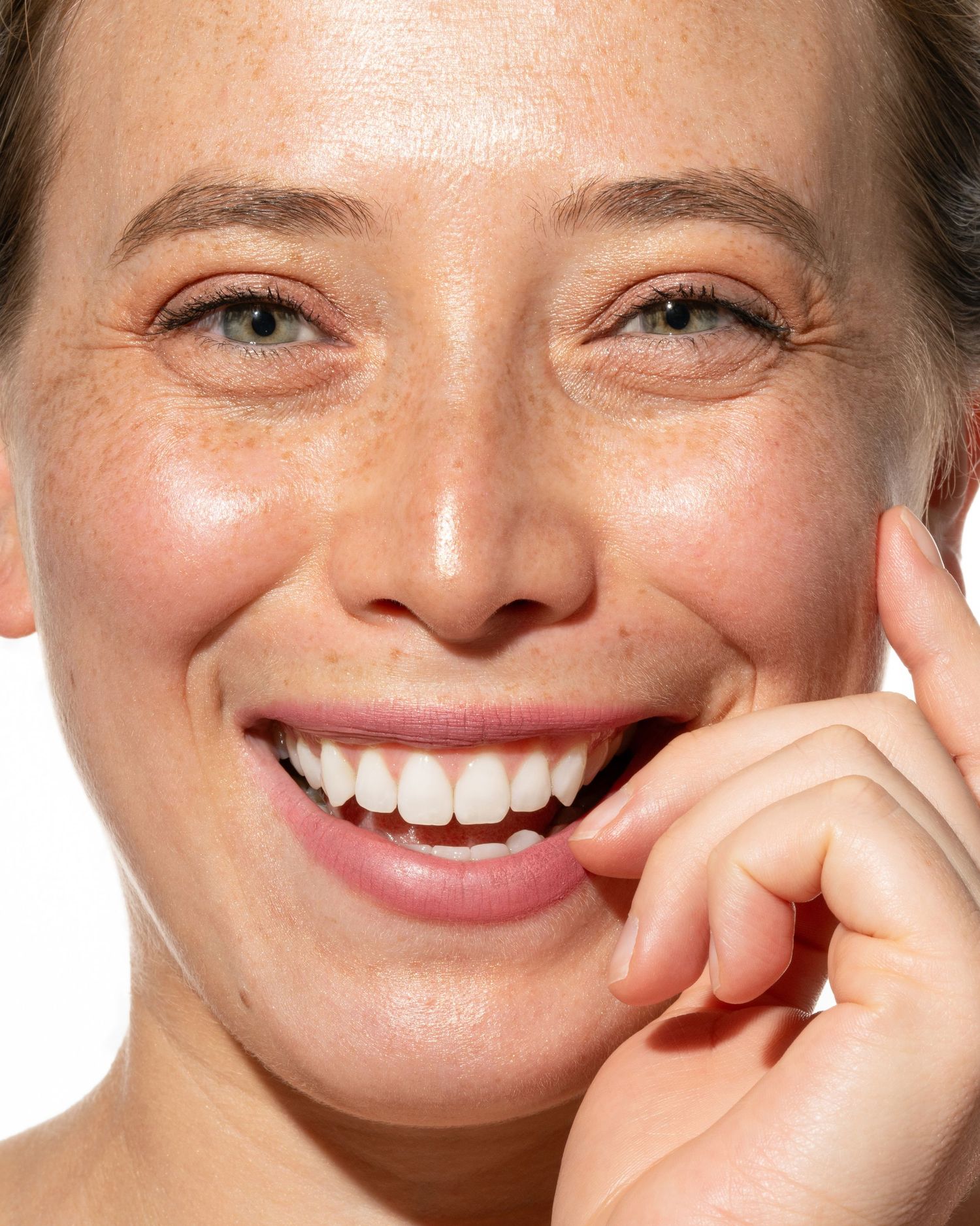 Close-up beauty portrait emphasizing natural skin texture. Commercial photography for cosmetic wellness and beauty services.