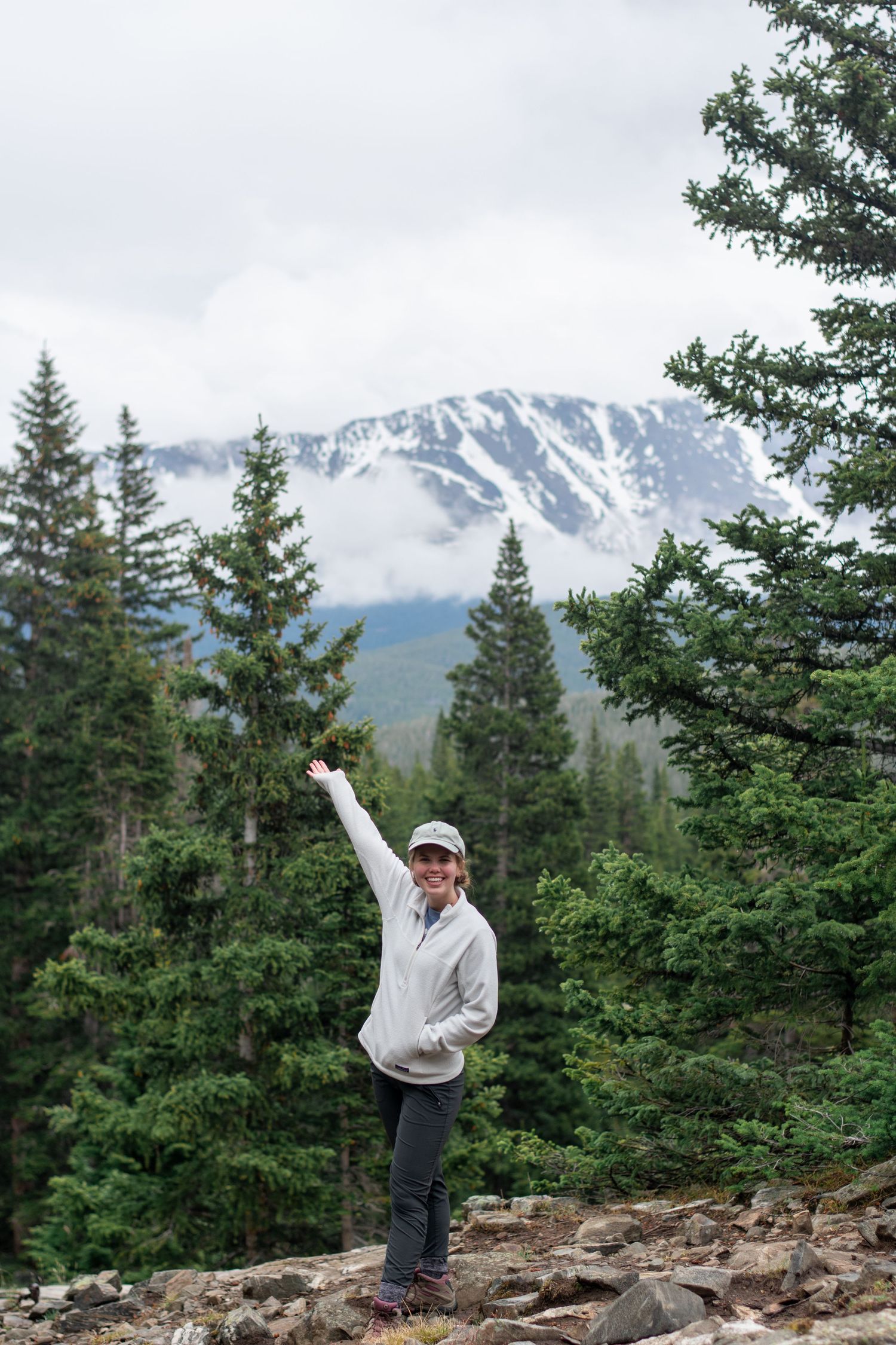 Photographer in front of mountain scene