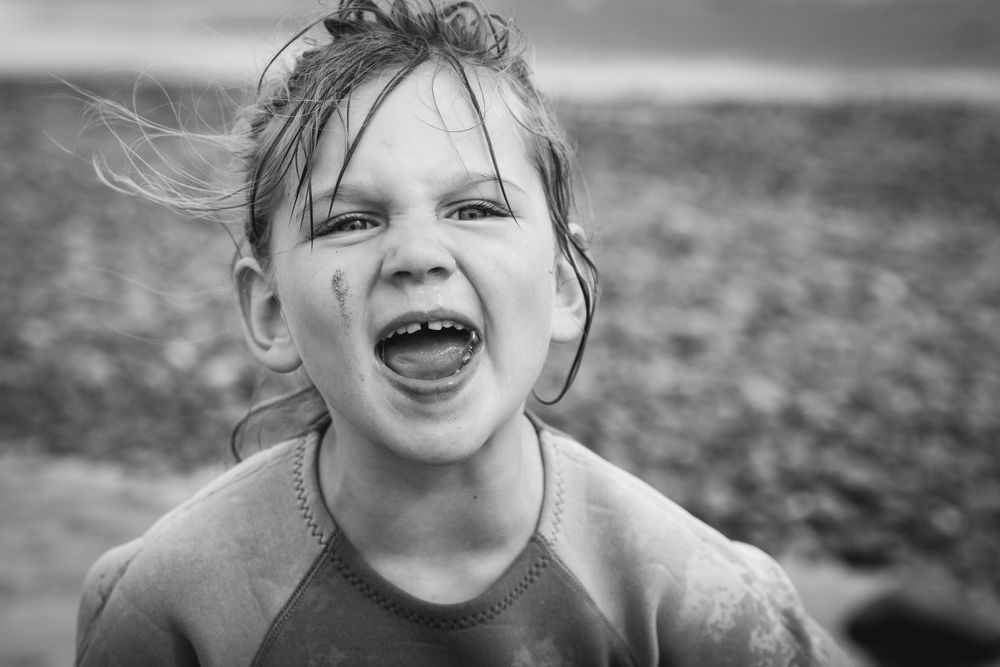 A joyful black and white closeup portrait capturing pure emotion.