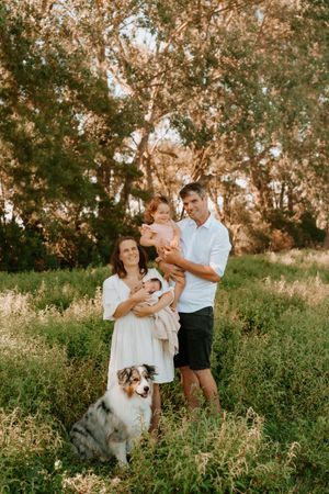on location newborn shoot under huge trees in summer waikato
