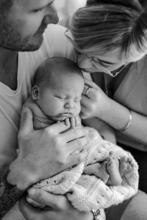 kissing baby on face during newborn shoot hamilton