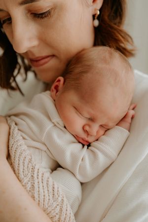 mum with her precious baby boy at hamilton newborn shoot