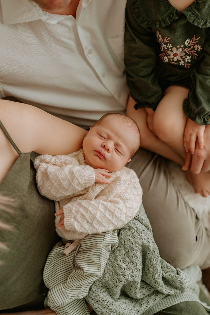 newborn resting in mums arms at hamilton studio