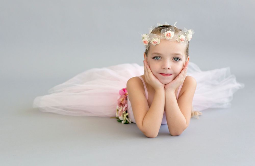 Classic dance portrait with pink tutu and floral crown.