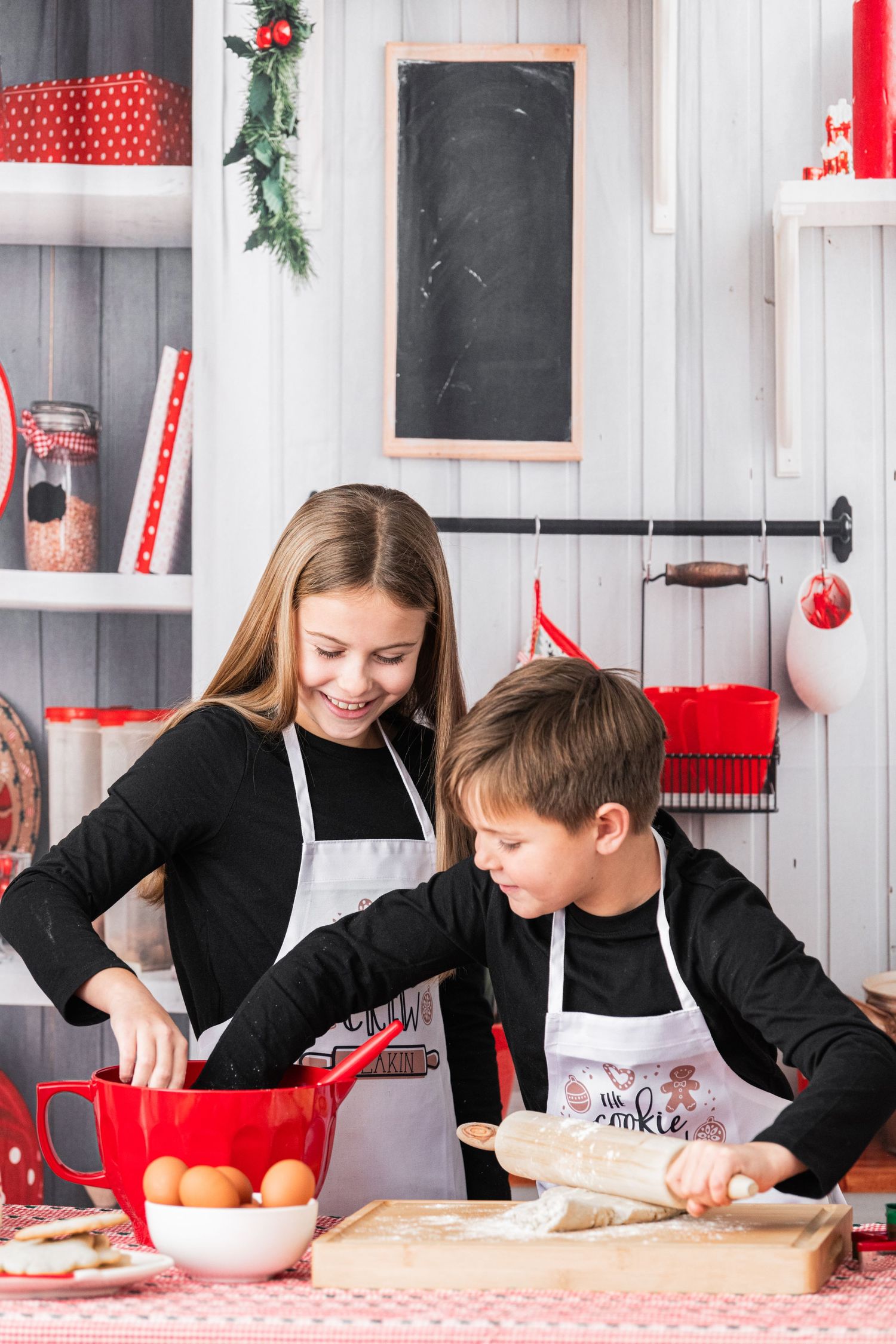 Cookie crew – siblings having fun baking cookies together in a beautiful kitchen at the studio, creating sweet memories.