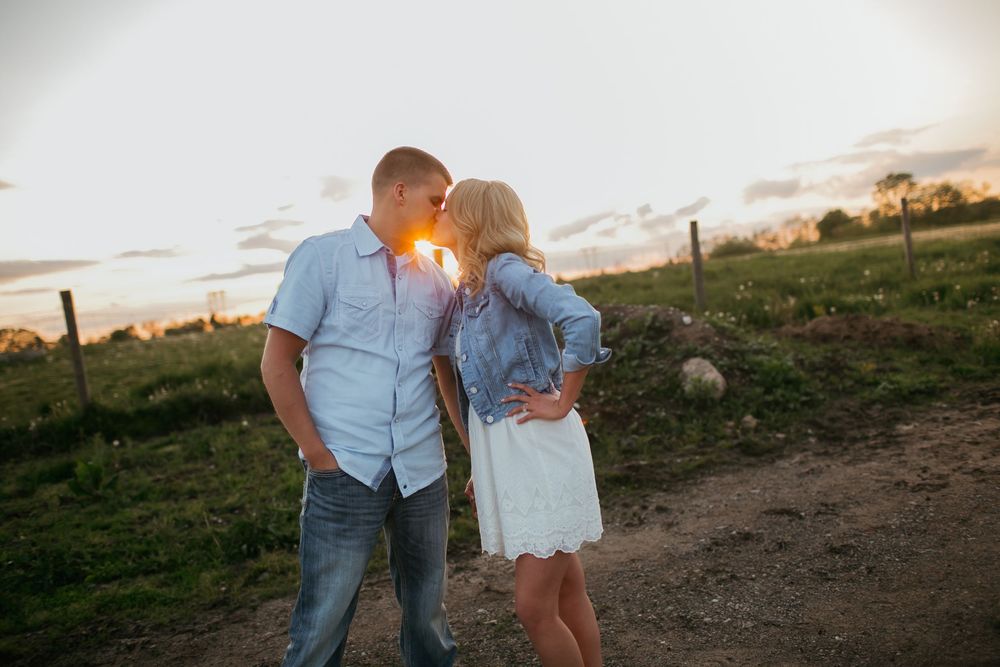 Engaged couple kissing Zionsville