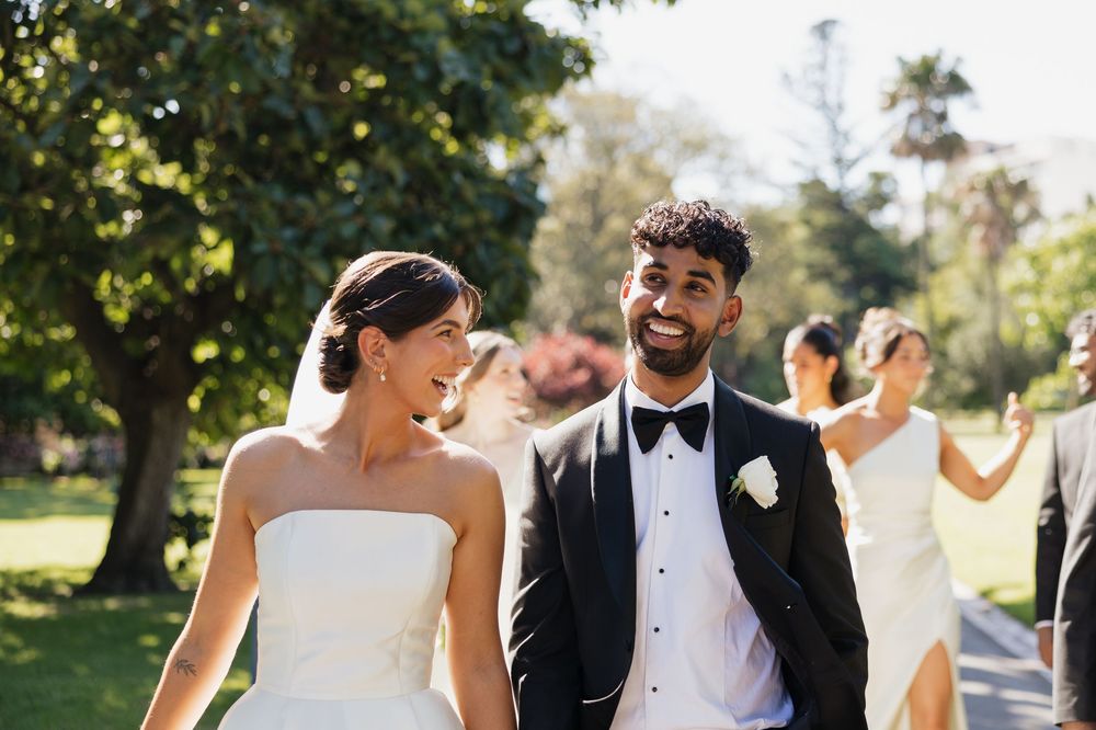 A collection of candid outdoor wedding photographs showing joyful moments between newlyweds in a garden setting.