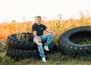 A sequence of photos showing someone posing with large tractor tires in a field at sunset.