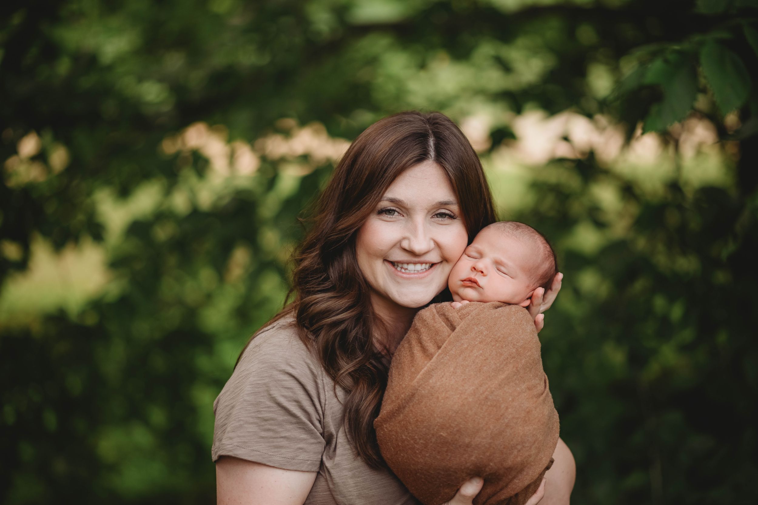 Candid family moments captured in a forest setting with natural lighting.
