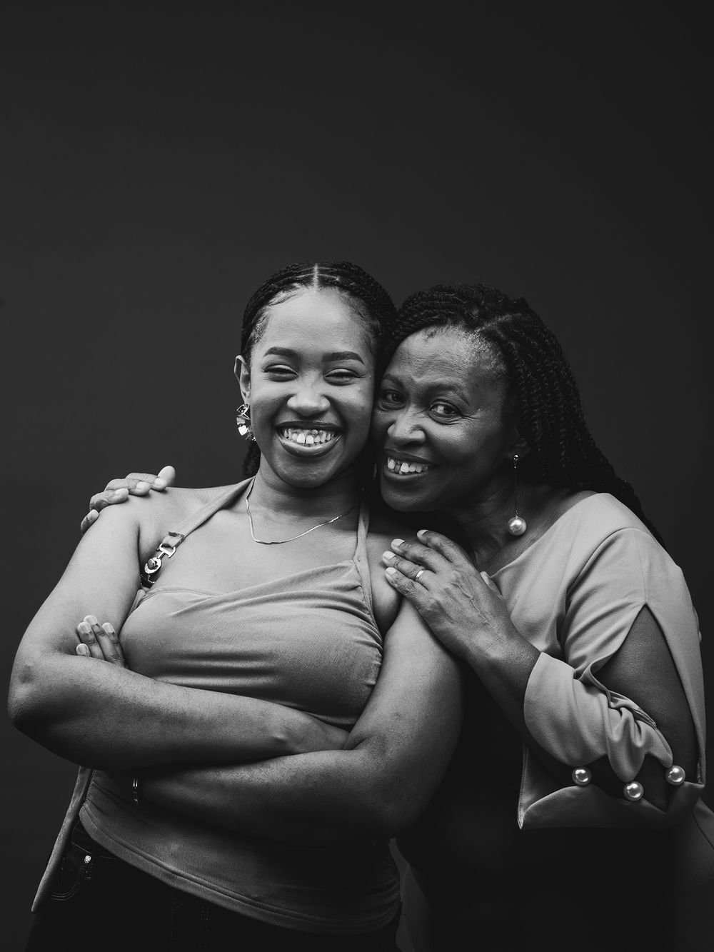A series of black and white photos showing joyful expressions and embraces between two people sharing intimate moments.