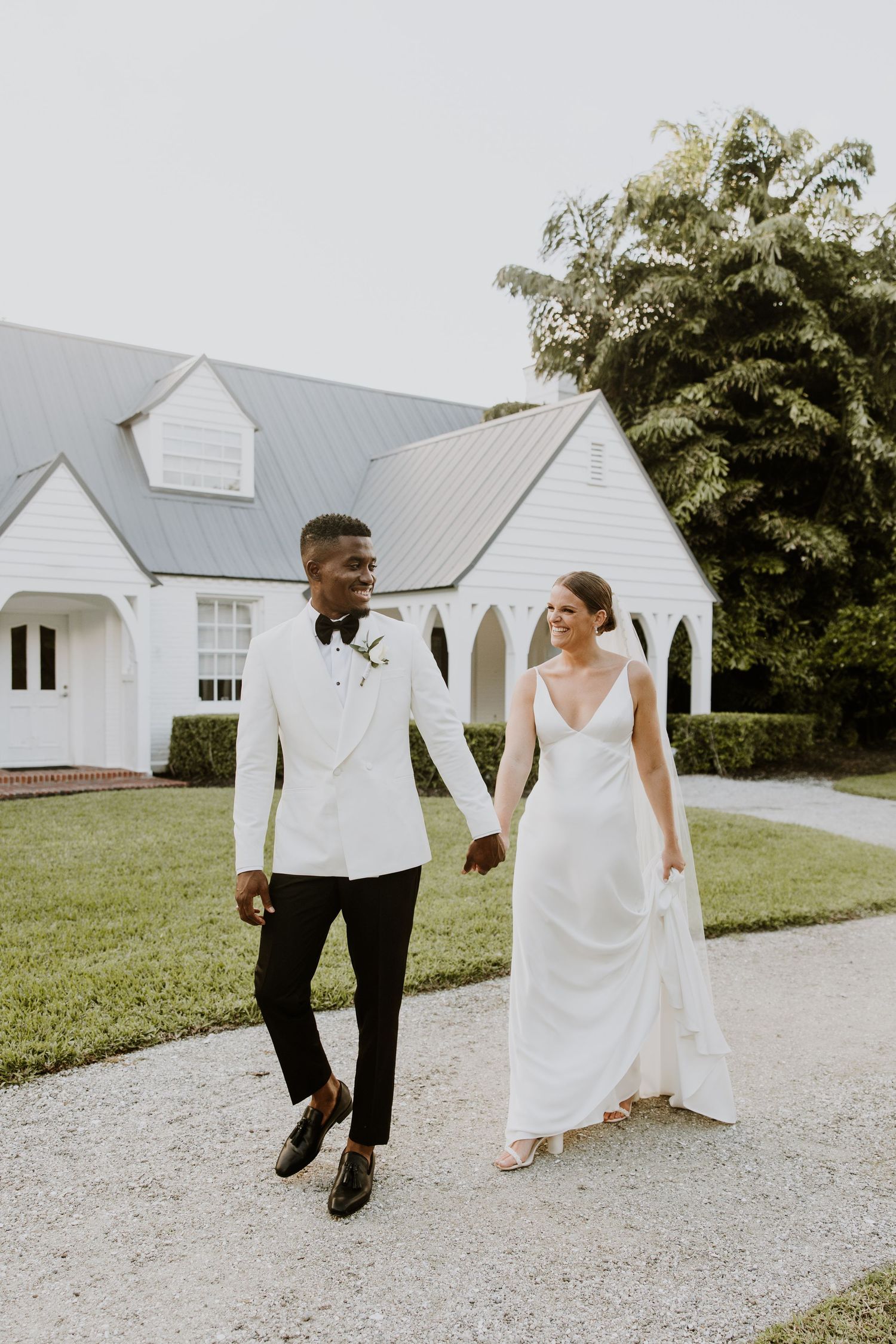 Golden Hour Bride & groom photos at wedding in Fort Pierce, FL at The Lake House venue captured by Lindsay McDow Photography. Vowd Weddings