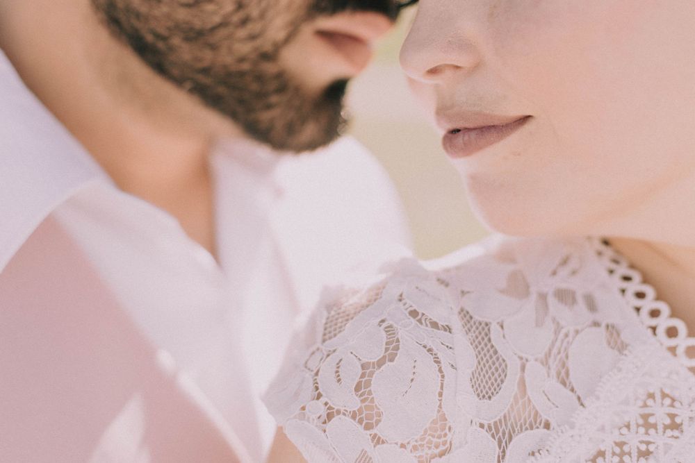Intimate close-up portraits showing tender moments between a couple.