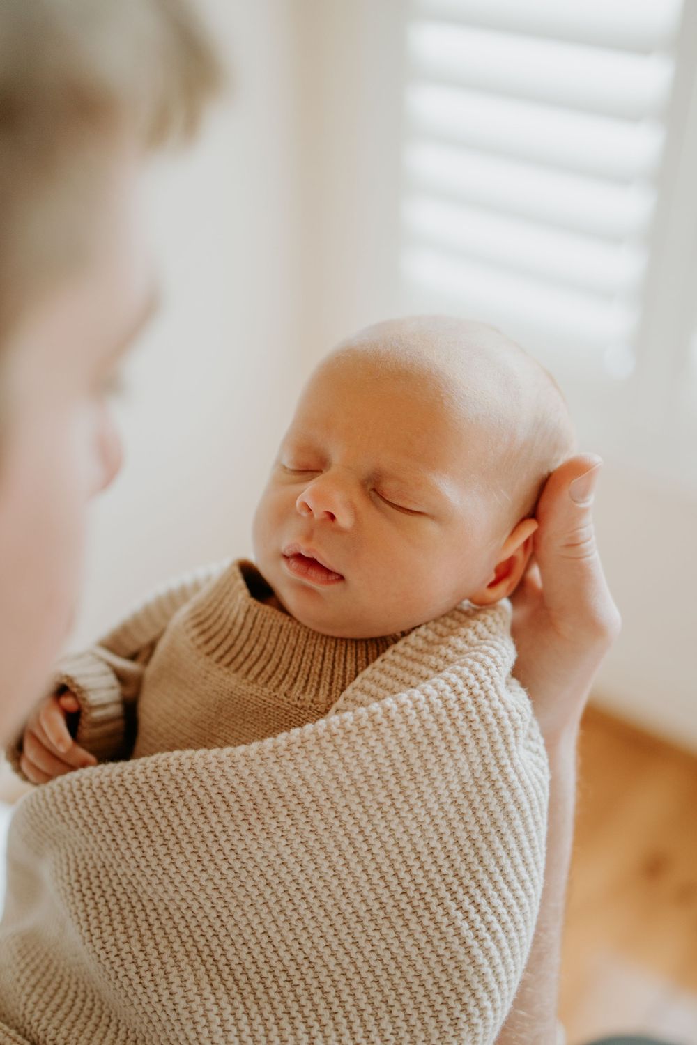 Adelaide newborn photographer - father holding newborn baby boy