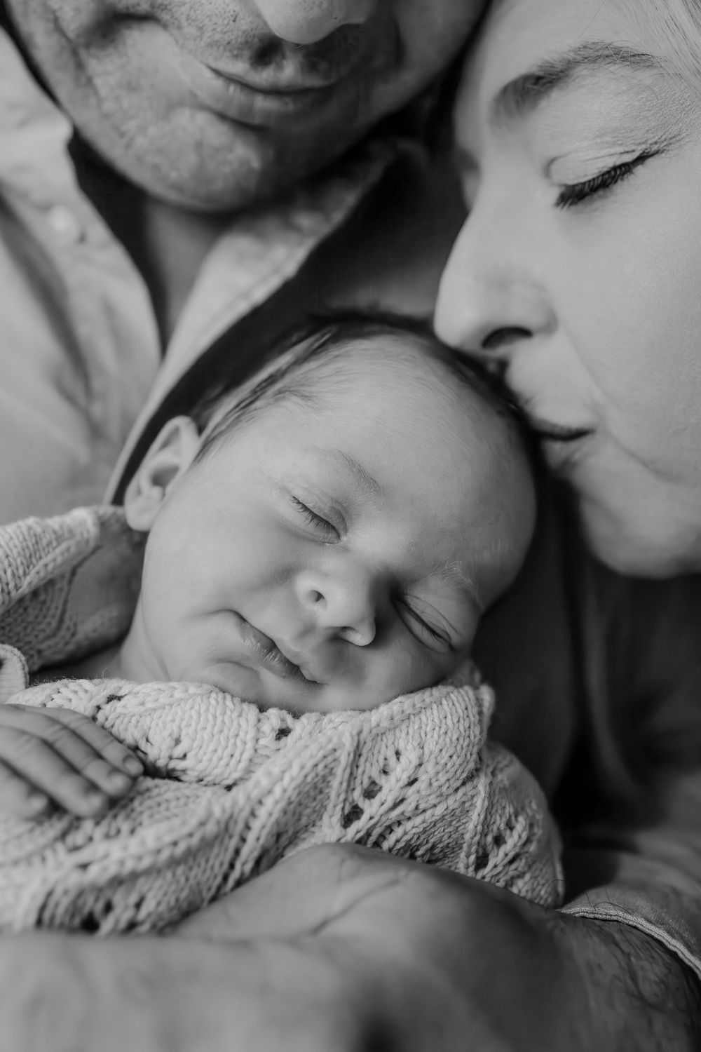 Adelaide newborn photographer - mother kissing newborn baby girl