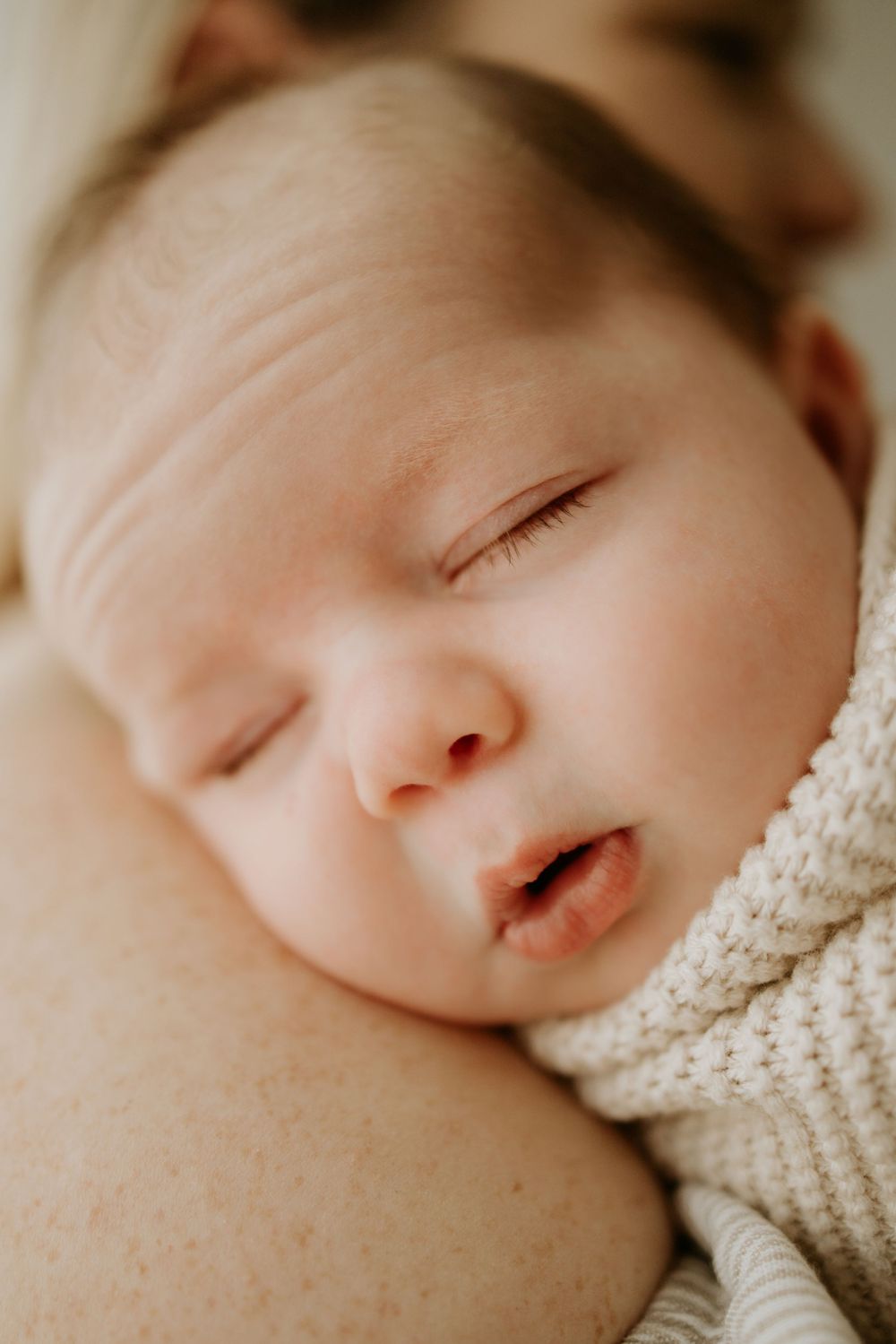 Adelaide newborn photographer - newborn baby boy asleep on mothers shoulder