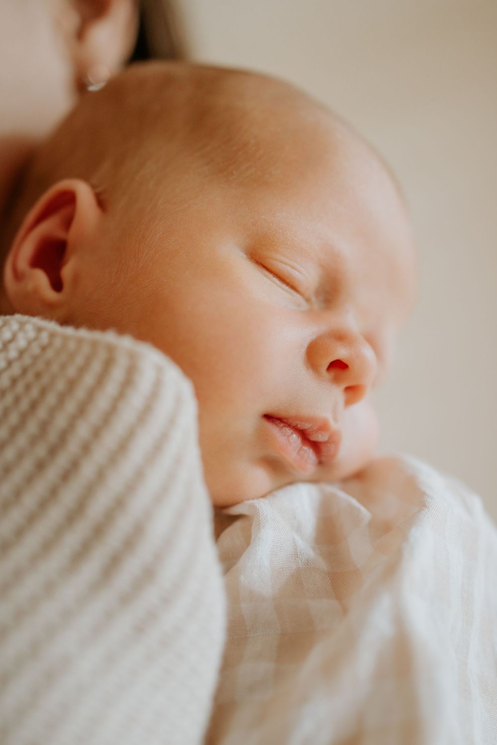 Adelaide newborn photographer - newborn baby boy asleep on mothers shoulder