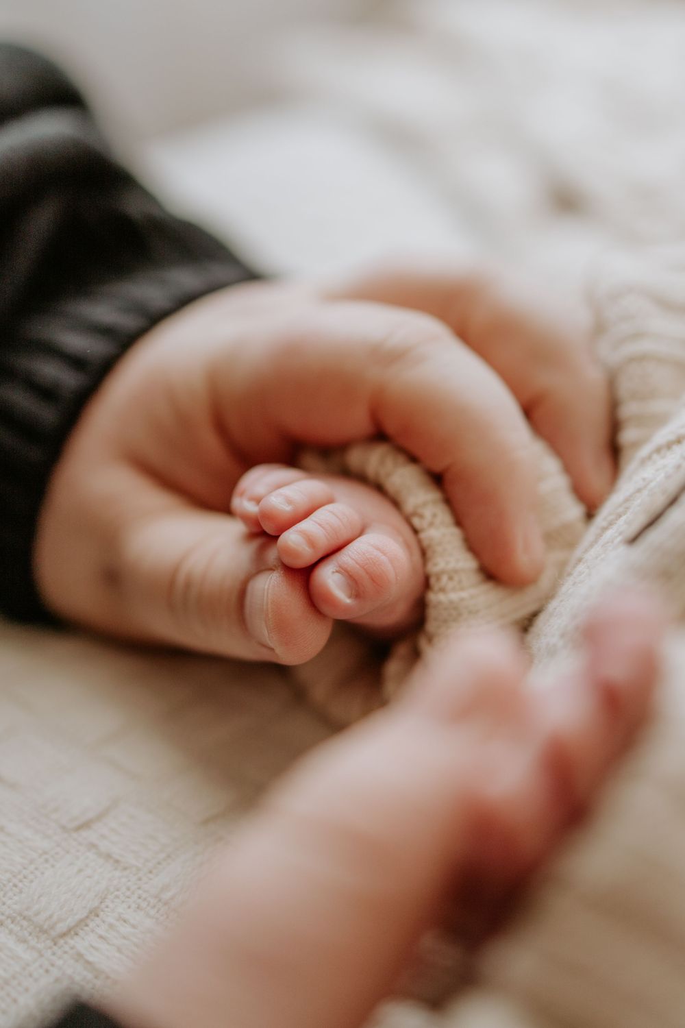 Adelaide newborn photographer - father holding newborn baby boys toes