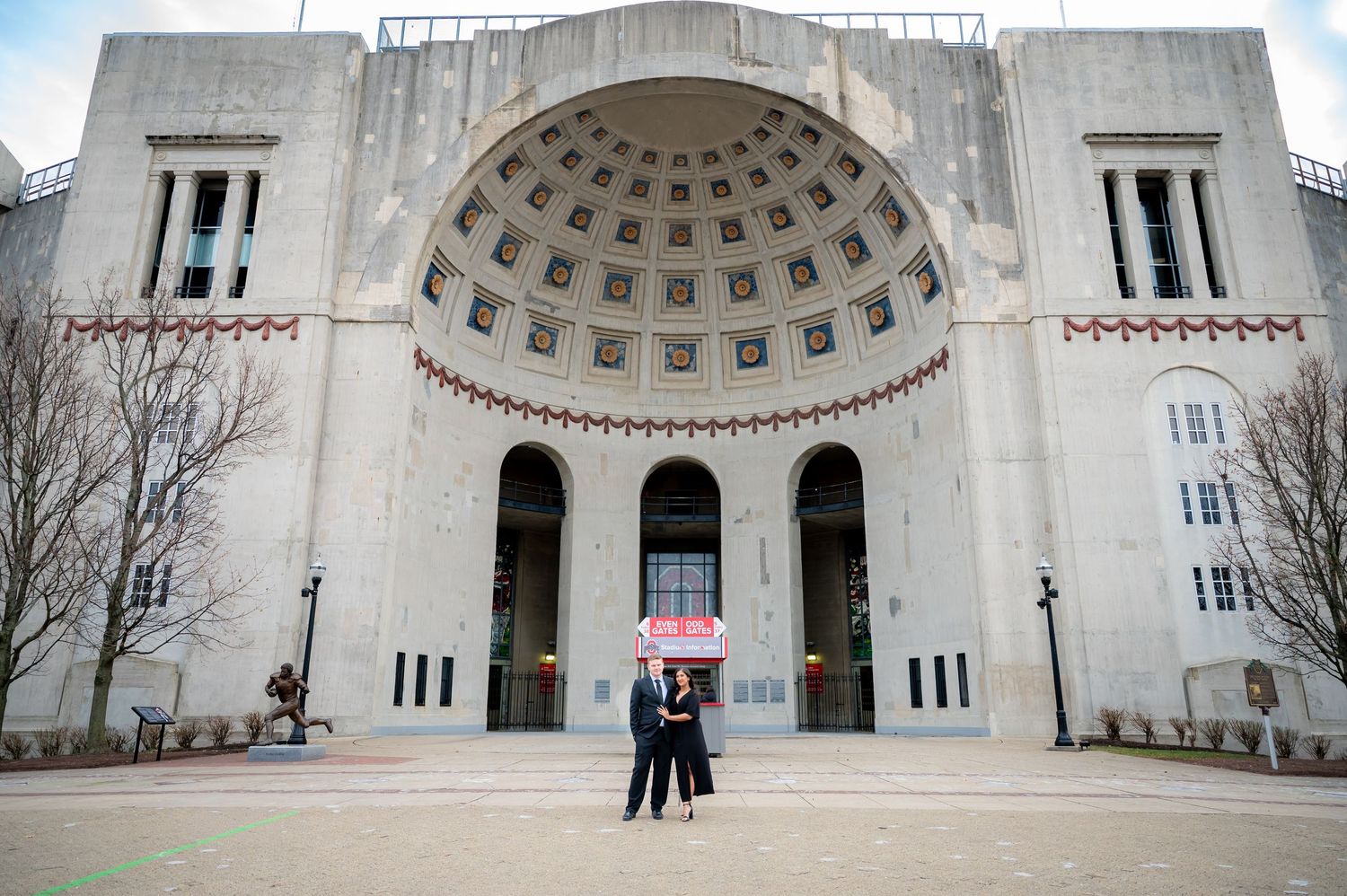Panoramic view of a neoclassical building facade featuring a grand domed entrance.
