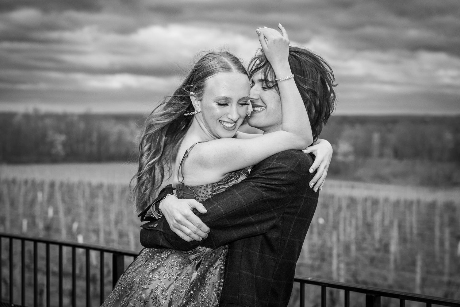 A romantic black and white photo series of a couple embracing in various outdoor settings.
