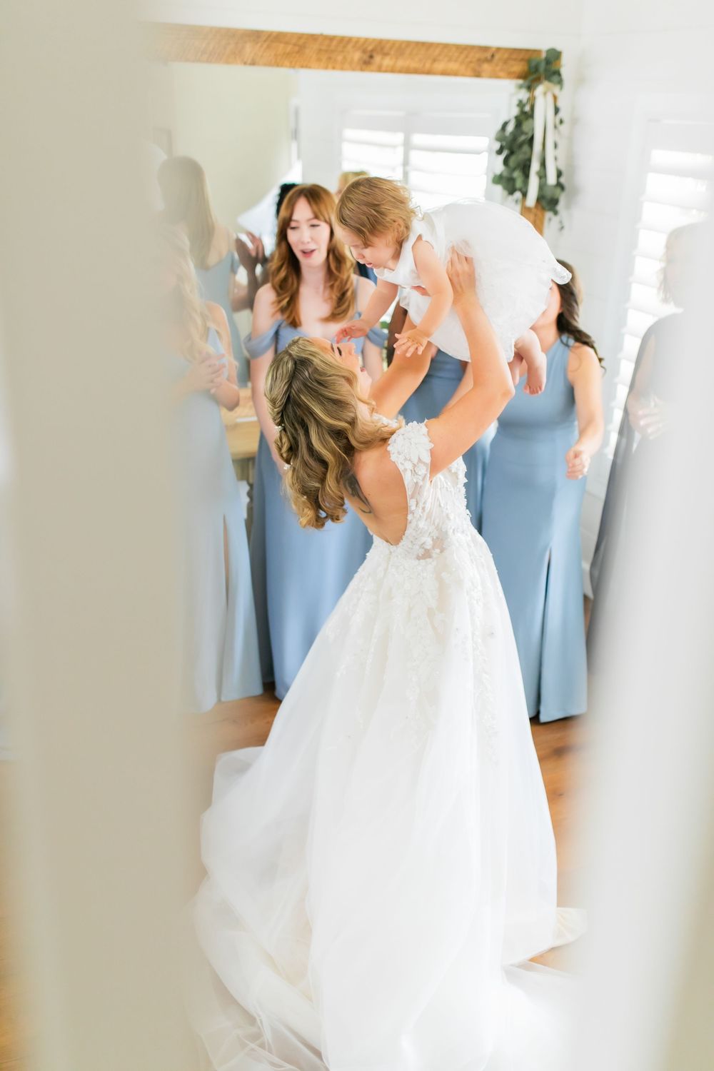 Bride playing with her baby