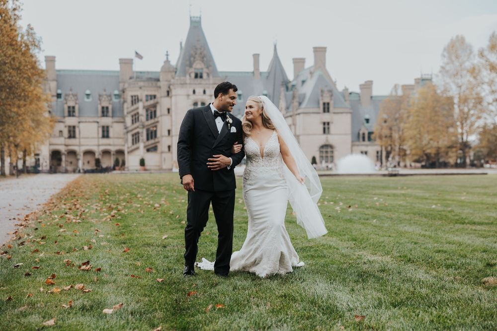Wedding photography series at a grand stone castle with classic architecture and autumn foliage.