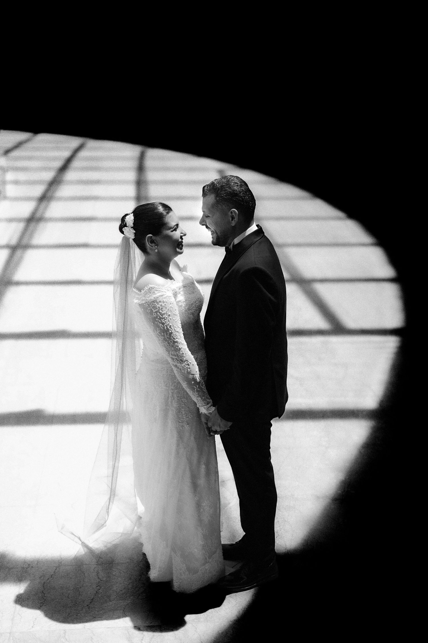 A romantic silhouetted sequence of a bride and groom in black and white showing their tender moments together.
