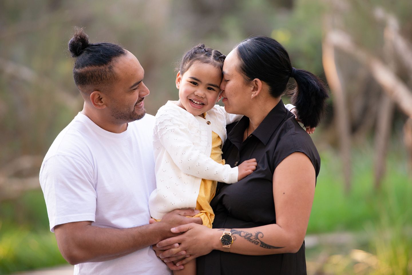 Young islander family of three in embrace - Kelly Chapman Photographer Perth