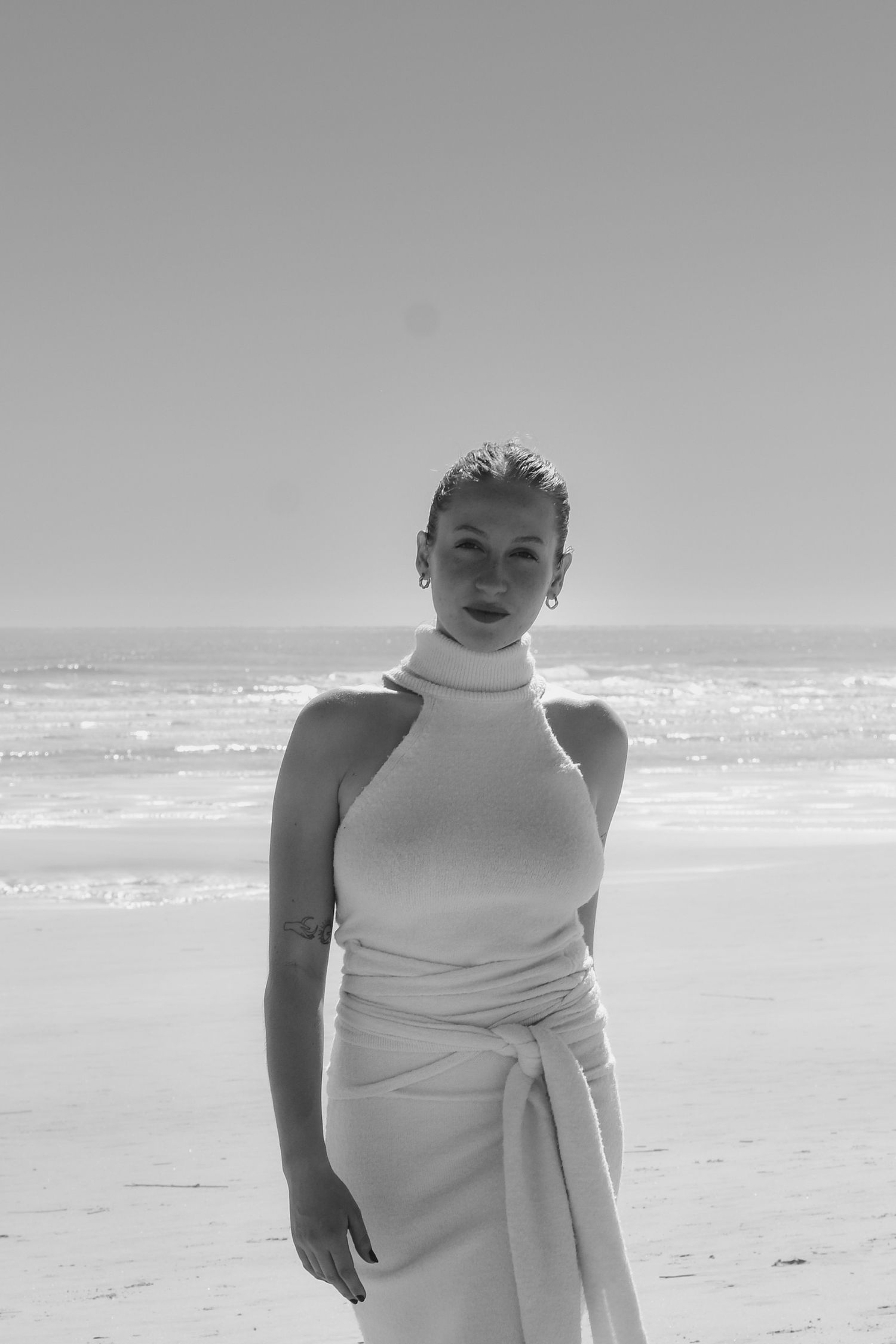 Georgia Leigh walking towards camera on beach