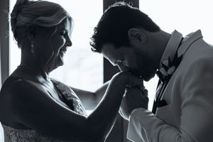 A black and white photo strip showing five intimate moments between a couple in silhouette.