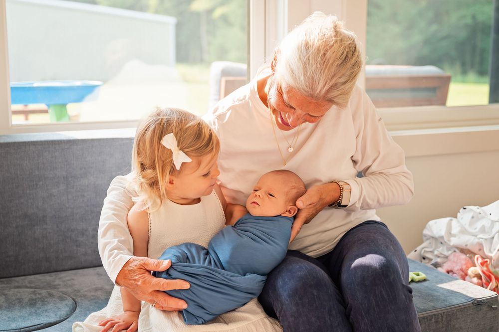 A series of candid family moments showing adults and children reading, playing and spending time together at home.