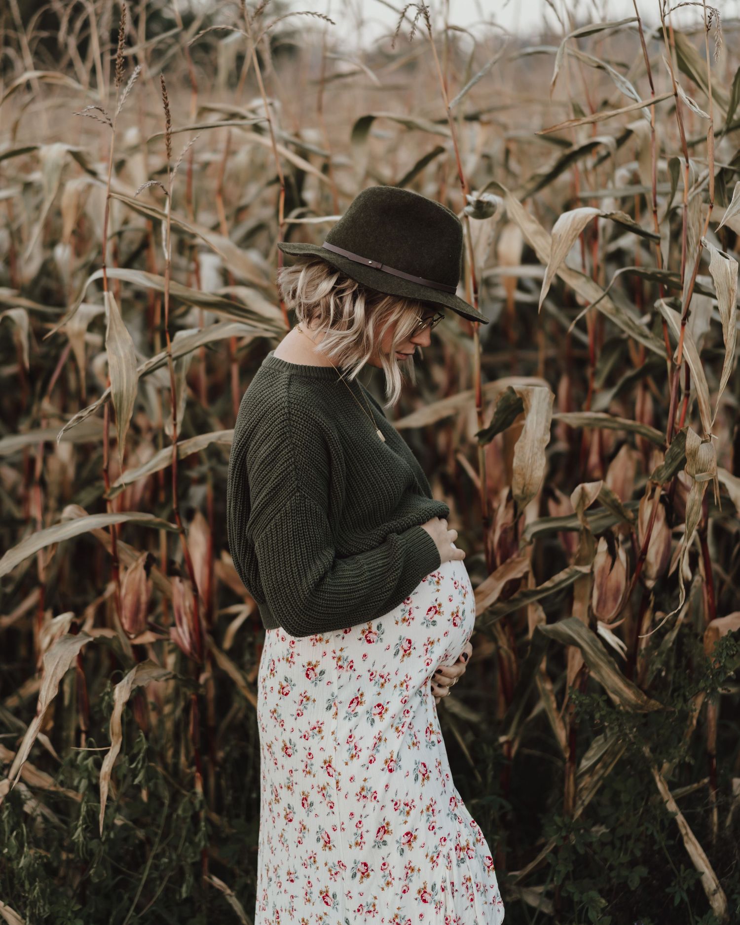 Mother to be maternity session in a corn field