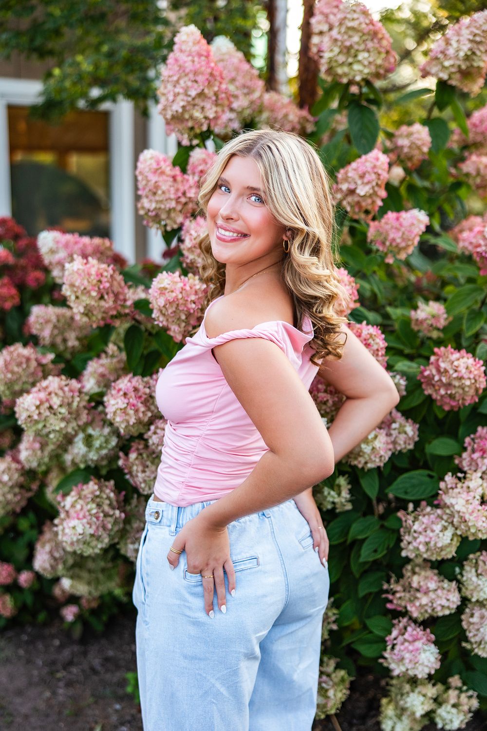 Teen girl senior photoshoot with natural lighting in Rochester, NY.