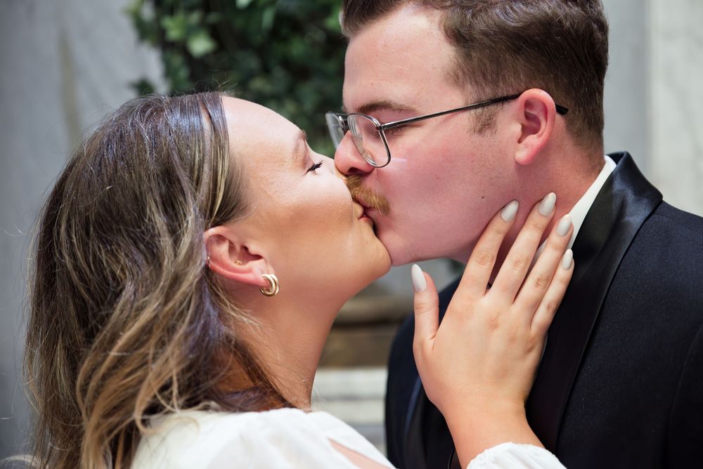 Intimate close-up wedding photos showing tender moments between the newlyweds.