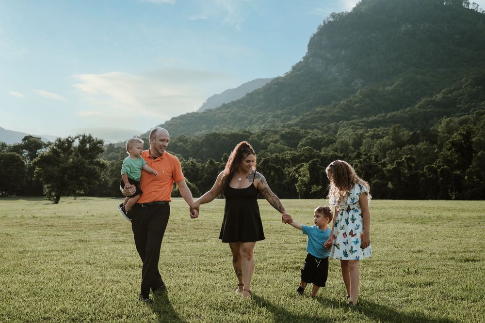 Family enjoying summer portrait session at Moses Cone Park, Lake Lure, NC.