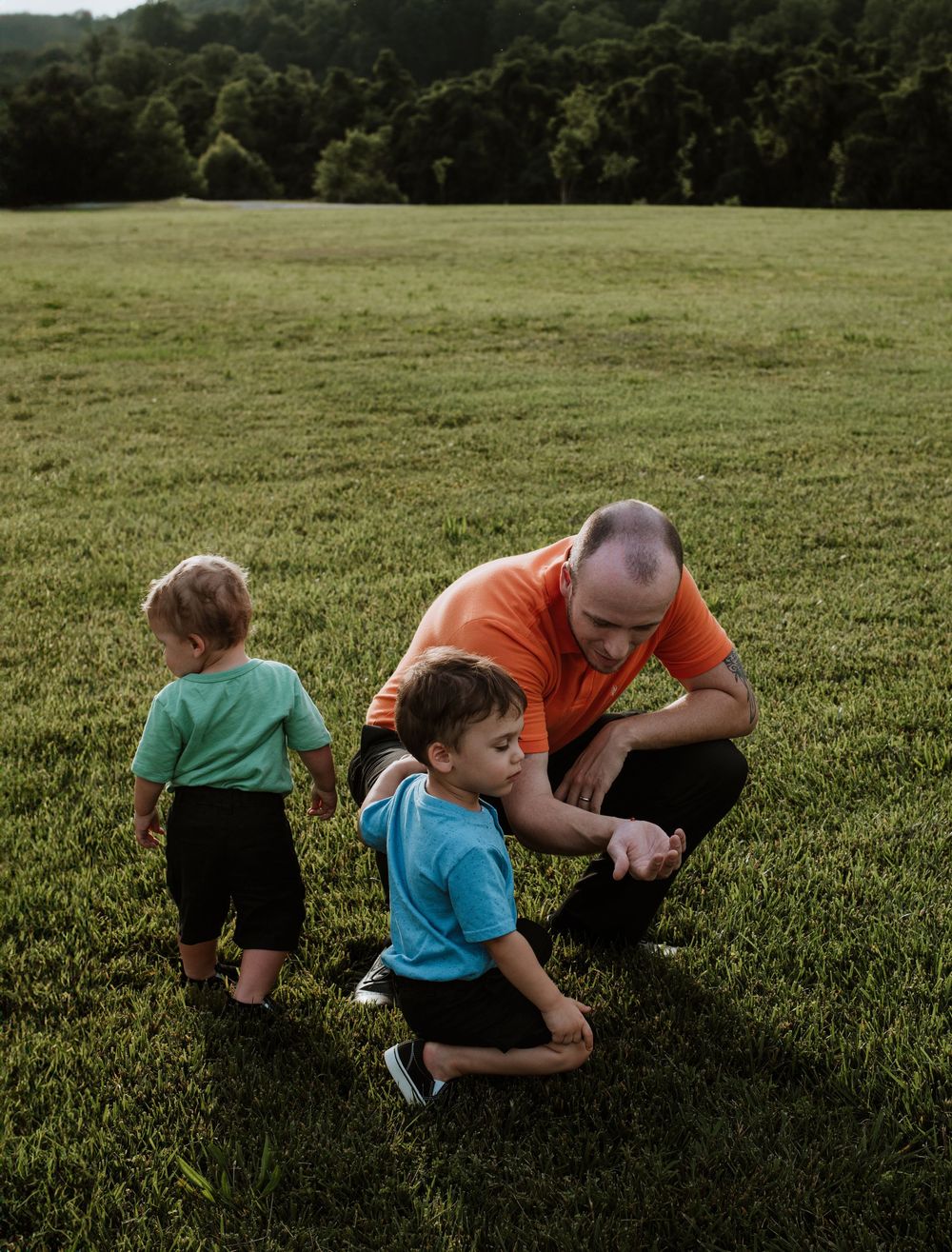 Family enjoying summer portrait session at Moses Cone Park, Lake Lure, NC.