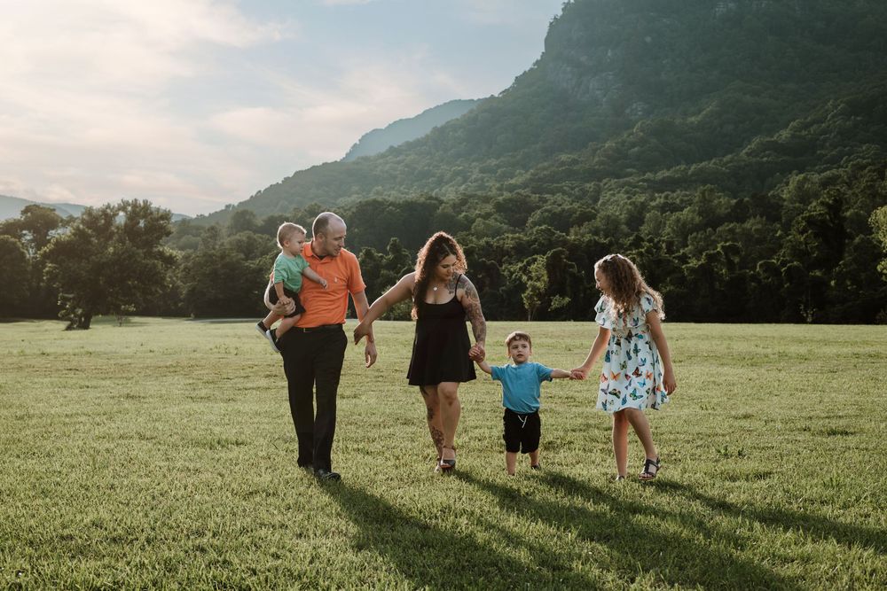 Family enjoying summer portrait session at Moses Cone Park, Lake Lure, NC.