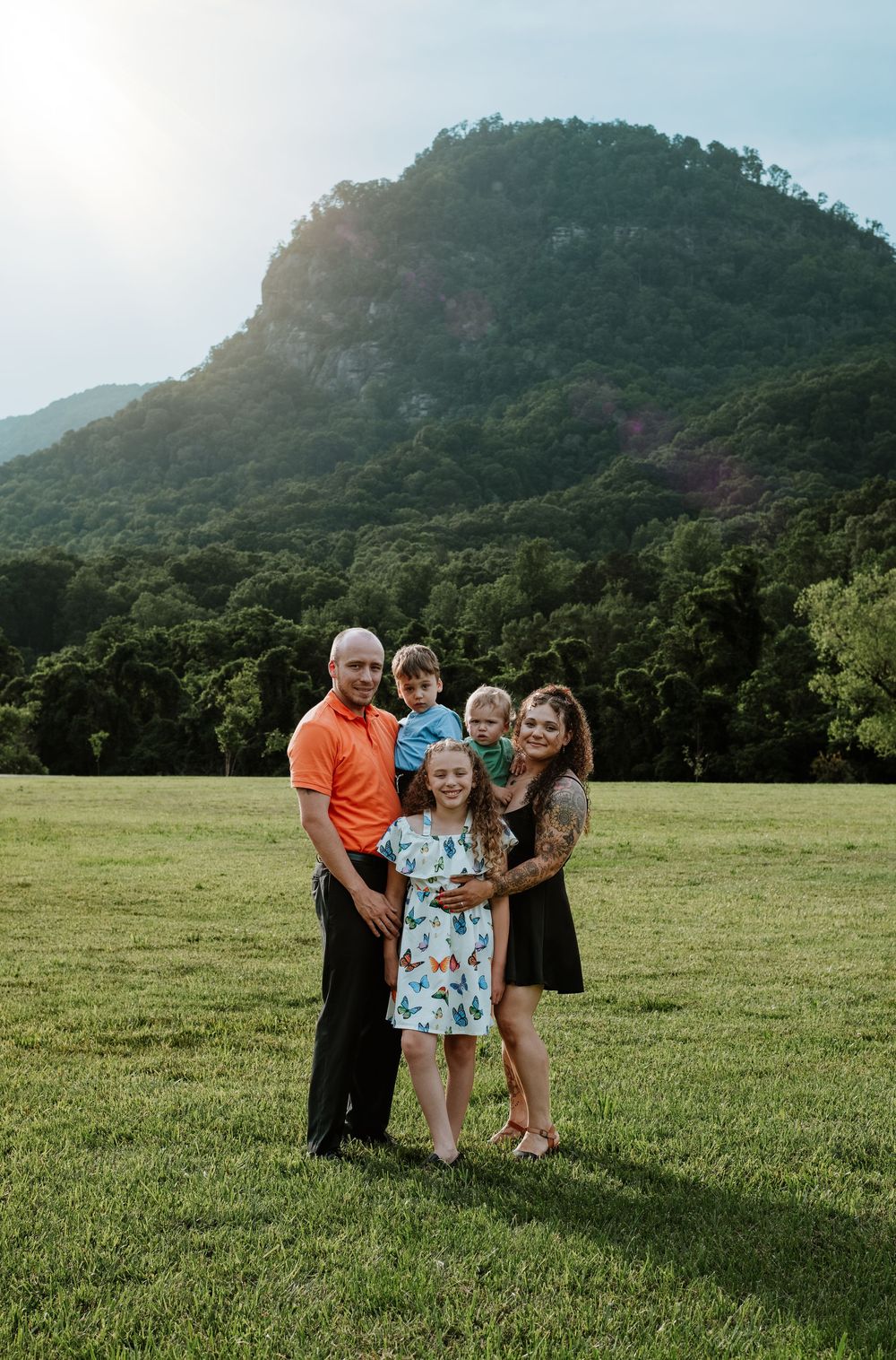 Family enjoying summer portrait session at Moses Cone Park, Lake Lure, NC.