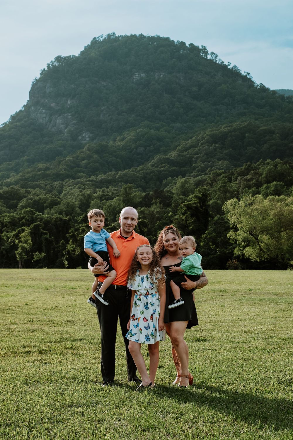 Family enjoying summer portrait session at Moses Cone Park, Lake Lure, NC.