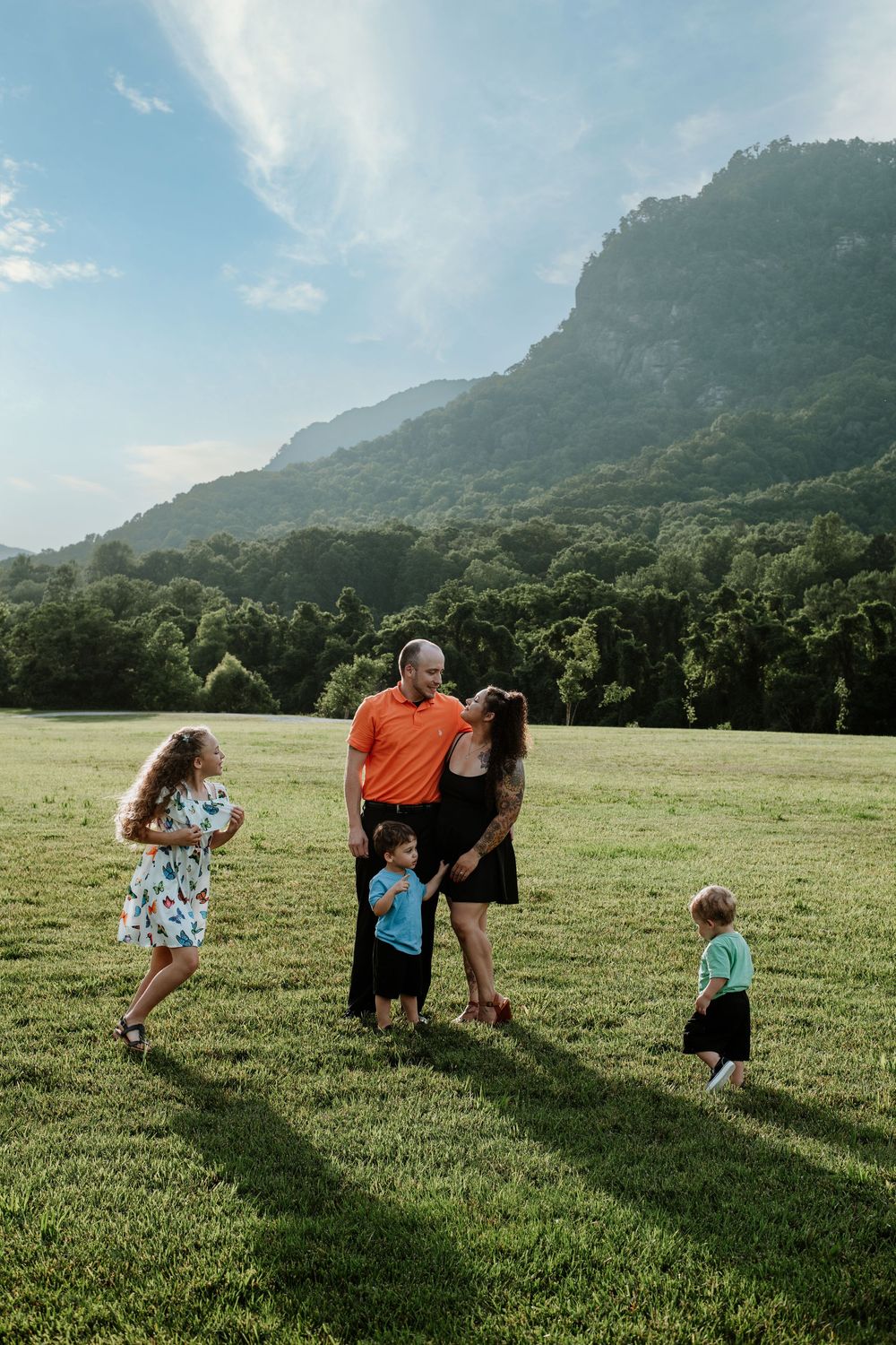 Family enjoying summer portrait session at Moses Cone Park, Lake Lure, NC.