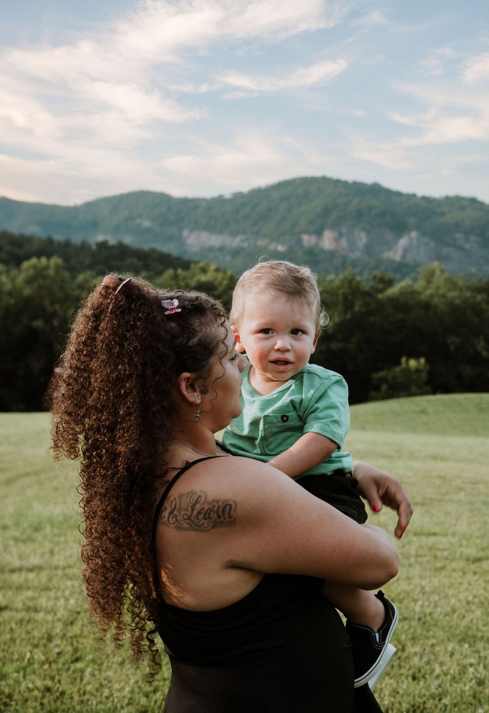 Family enjoying summer portrait session at Moses Cone Park, Lake Lure, NC.