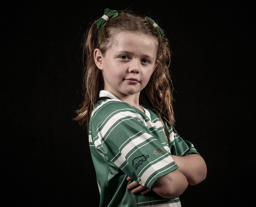 A sequence of photos showing a young athlete in a green sports jersey turning and posing with crossed arms.