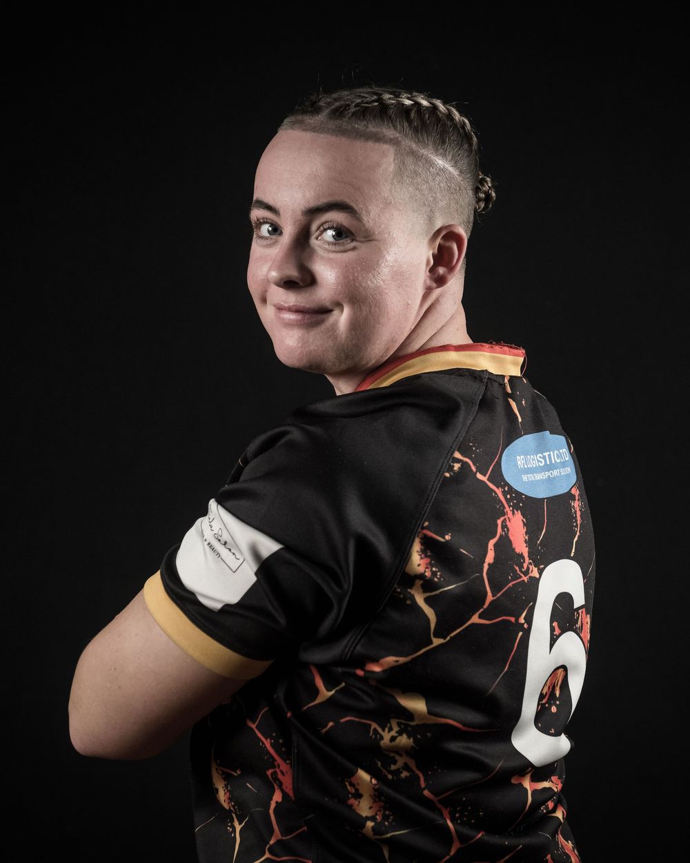Portrait series showing a person in black t-shirt with orange accent against dark background making various facial expressions.