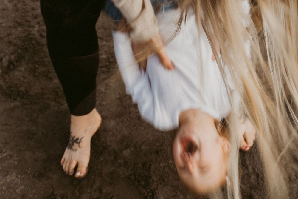 Close-up shot of playful moments on sandy beach.