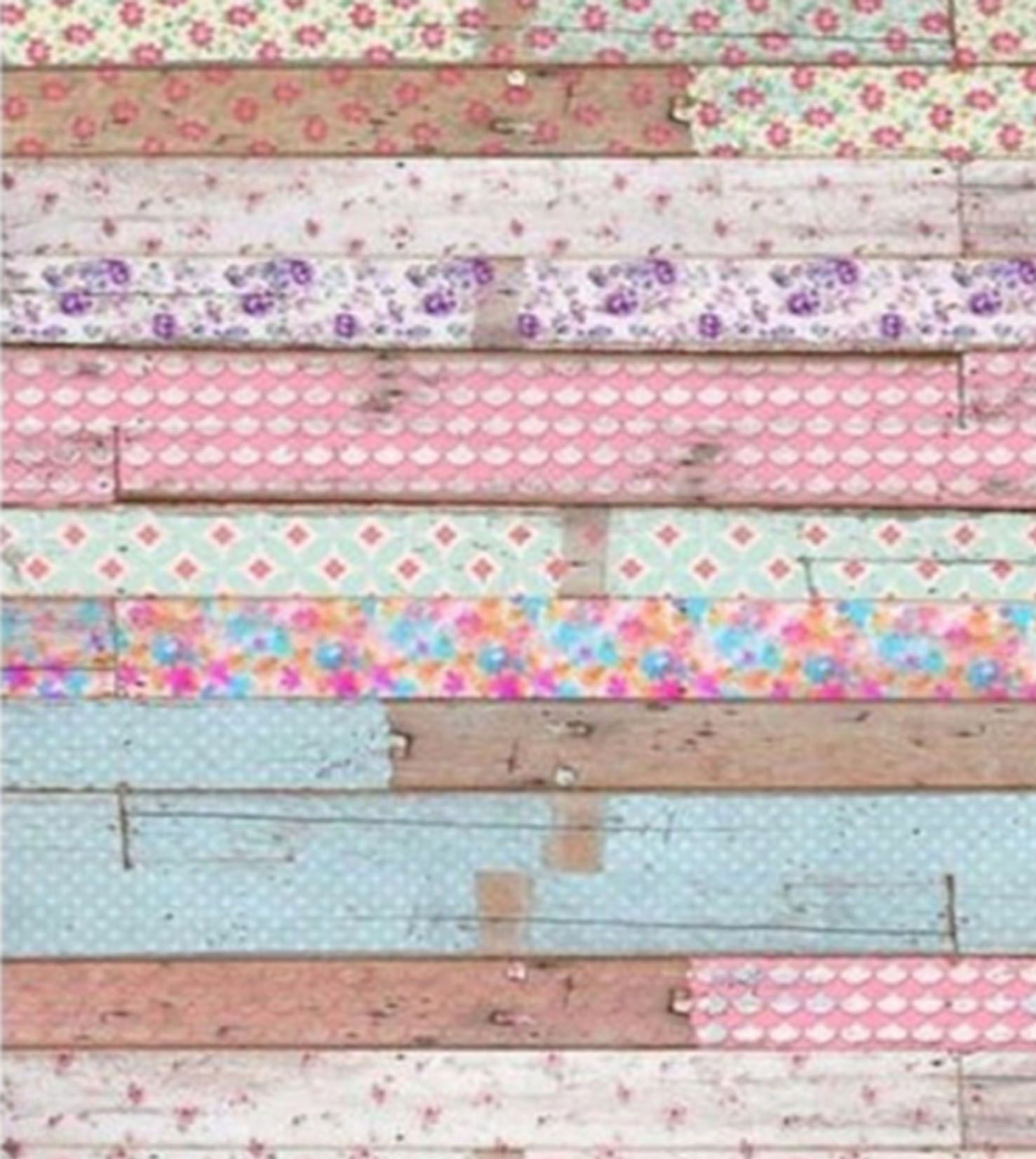 Colorful patchwork floral and geometric patterned fabric strips arranged horizontally on rustic distressed wooden planks.