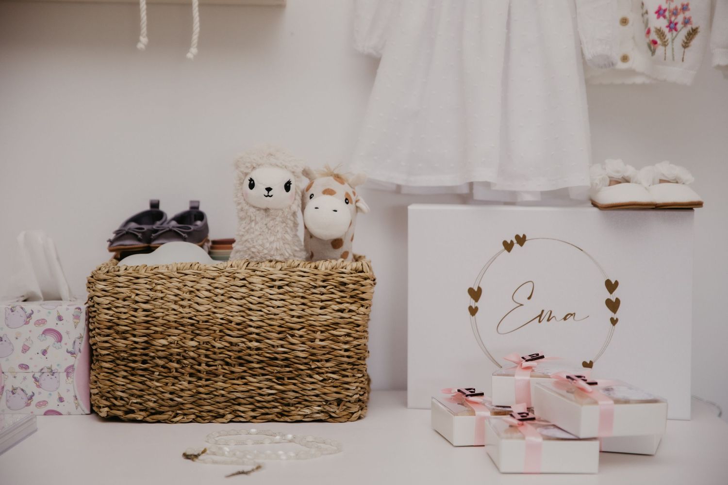 Wedding decorations with stuffed animals on wicker basket and elegant gift box.