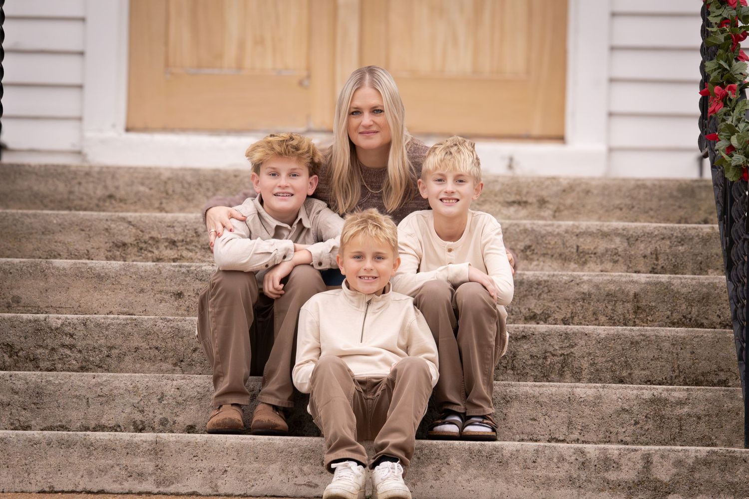 A series of candid family portraits taken on outdoor stone steps with warm sepia tones.