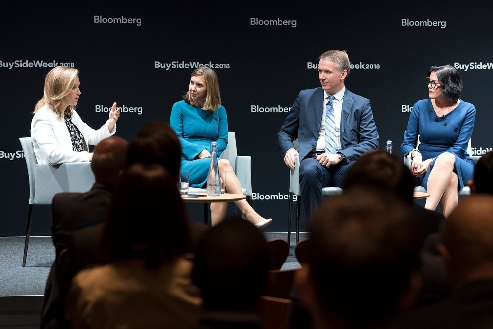 Bloomberg BuySide Week panel discussion with five business professionals seated on stage.