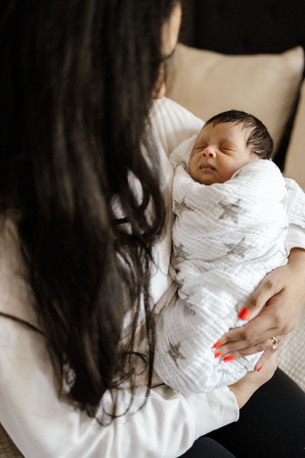 Baby swaddled at in-home lifestyle newborn photoshoot by Cindy Tucey Photography in Los Gatos, California