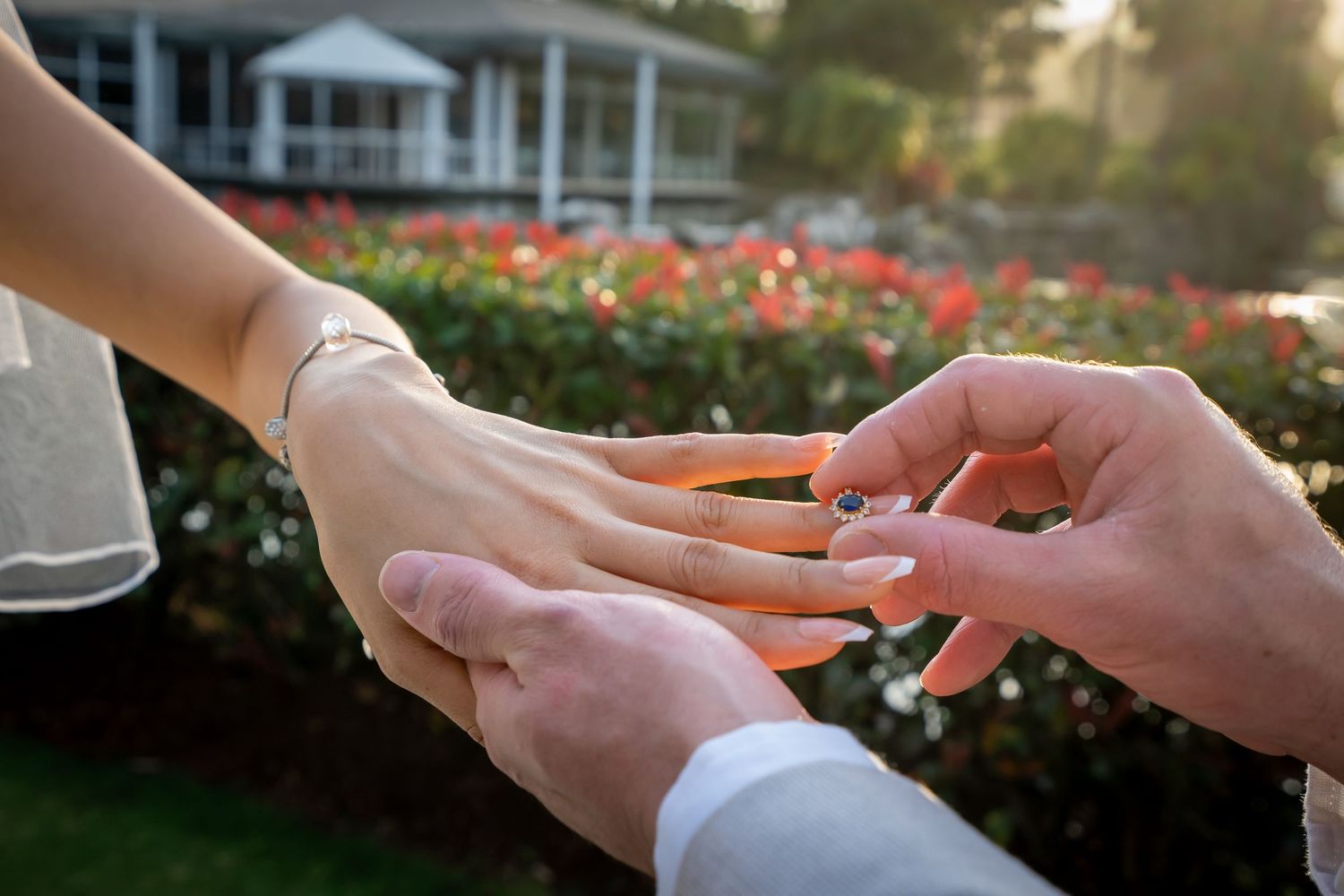A sequence of photos showing hands exchanging wedding rings during a marriage ceremony.